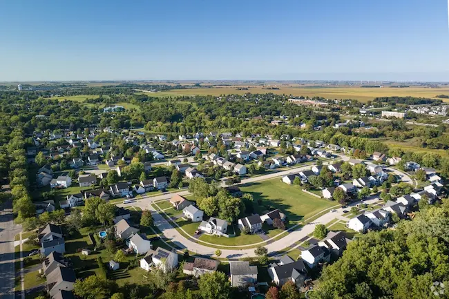 Aerial view of DeKalb IL residential neighborhood surrounded by greenery where Pure Auto Care provides mobile car detailing